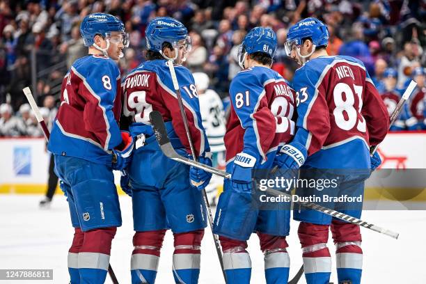 Denis Malgin of the Colorado Avalanche celebrates with Alex Newhook, Cale Makar, and Matt Nieto after scoring a second period goal against the San...