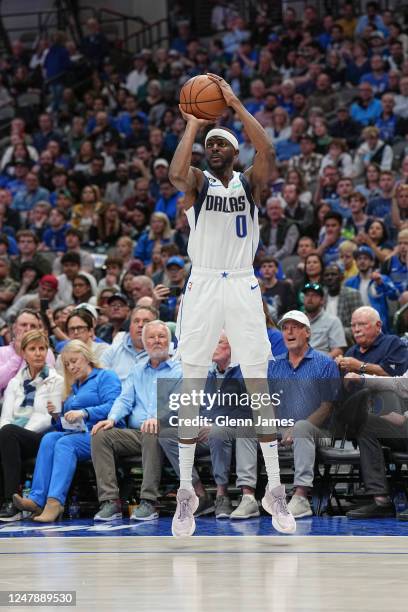 Justin Holiday of the Dallas Mavericks shoots a three point basket during the game on March 7, 2023 at the American Airlines Center in Dallas, Texas....