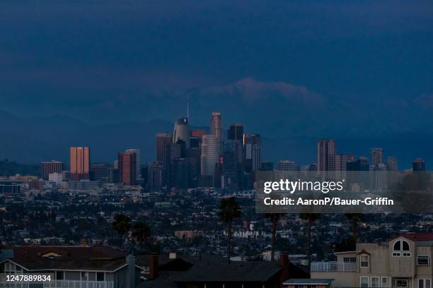 General views of the Downtown Los Angeles skyline against the snowy San Gabriel Mountains on March 07, 2023 in Los Angeles, California.