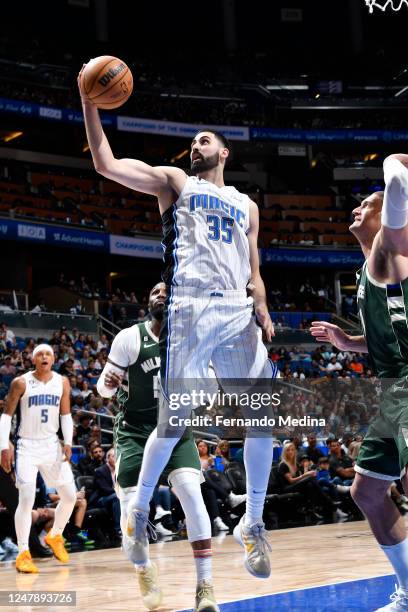 Goga Bitadze of the Orlando Magic rebounds the ball during the game against the Milwaukee Bucks on March 7, 2023 at Amway Center in Orlando, Florida....