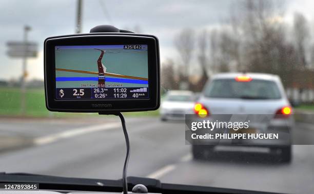 Picture taken on January 8, 2012 in Bailleul, northern France, shows a car using a Global Positioning System on the highway A25. A new law in France...