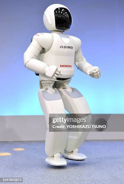 Honda robot named 'Asimo' hops on one leg during a demonstration of its new fuctions, at the company's laboratory in Wako city, suburban Tokyo on...