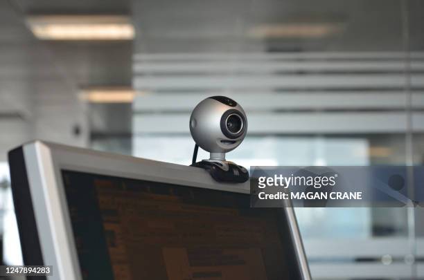 This photo shows a webcam on top of a computer at an office in London on June 1, 2011. AFP PHOTO/MAGAN CRANE