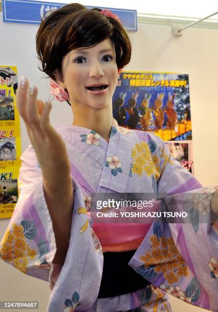 165cm tall humanoid robot "Actroid" wearing a Kimono dress and produced by Japanese robot maker Kokoro, gestures at Sanrio's headquarters in Tokyo,...