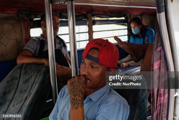 Jeepney drivers refuse to ply their routes as commuters pass by their terminal in Manila, Philippines on 7 March 2023. Transport groups launched a...