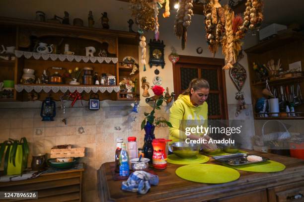 Sylwia Pieczara, a journalist at TVP Krakow, prepares lunch at her home, on March 7 in Krakow, Poland. Aside from enjoying sports and walking her...