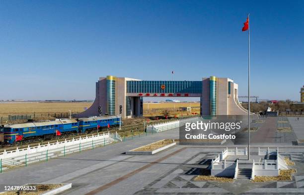 Aerial photo taken on March 8, 2023 shows a China-Europe freight train entering Erlianhot City in Xilin Gol League, Inner Mongolia, China. The number...