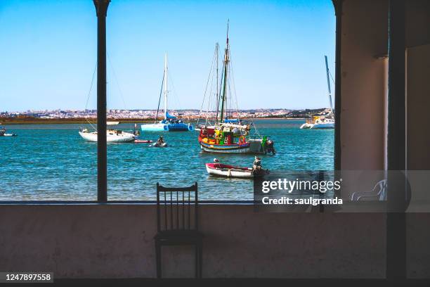 fishing boats from a point of view - alvor stock pictures, royalty-free photos & images