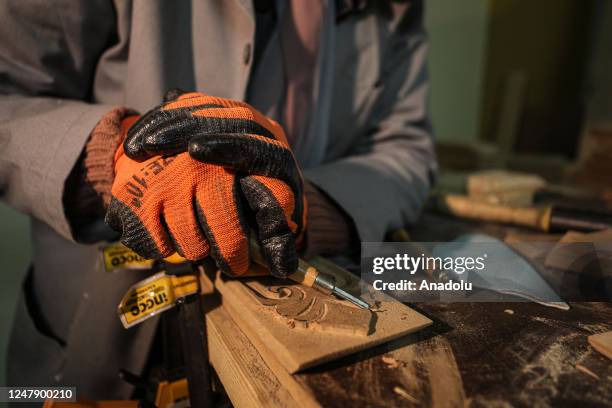 Year-old Palestinian young female carpenter Rezzan al-Burunu works at her carpentry workshop she established to create job opportunities in the city...