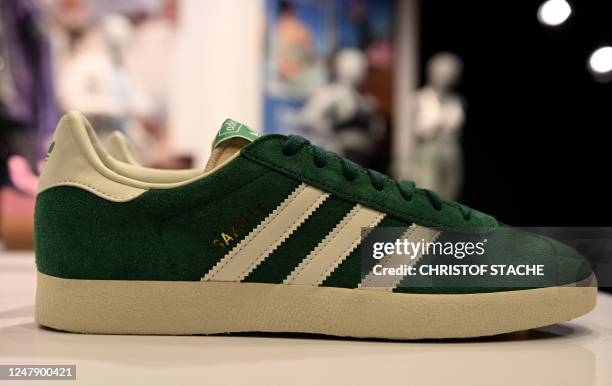 Shoe of German sports equipment maker Adidas is pictured prior to the company's annual press conference in Herzogenaurach, southern Germany on March...