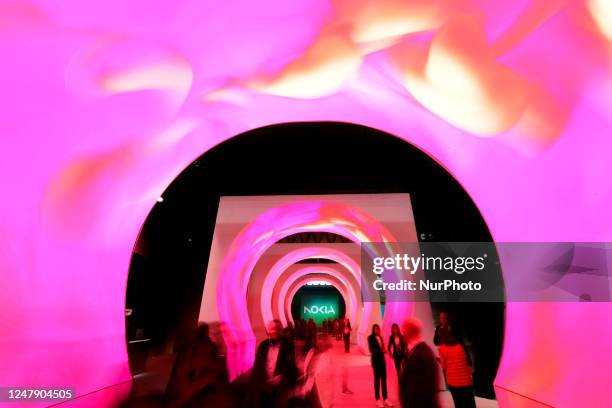 Congress visitors passing by the entrance of the Nokia stand that featured the new redesigned logo. The Finnish company announced the rebranding and...