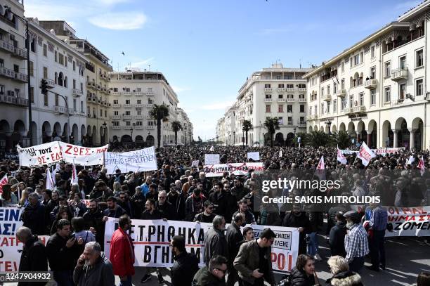 People take part in a demonstration as part of a nationwide day of mass strikes and protests over the country's worst rail tragedy that killed 57...