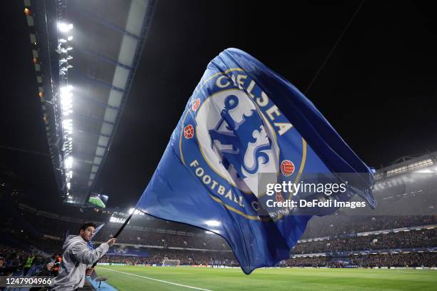 Chelsea FC match day flag waver on the pitch prior to the UEFA Champions League round of 16 leg two match between Chelsea FC and Borussia Dortmund at...