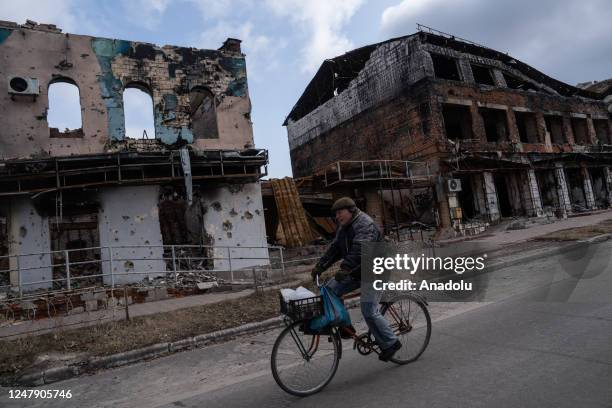 Ukrainian civilian bikes in a destroyed neighborhood in Izium, Ukraine on March 07, 2023.