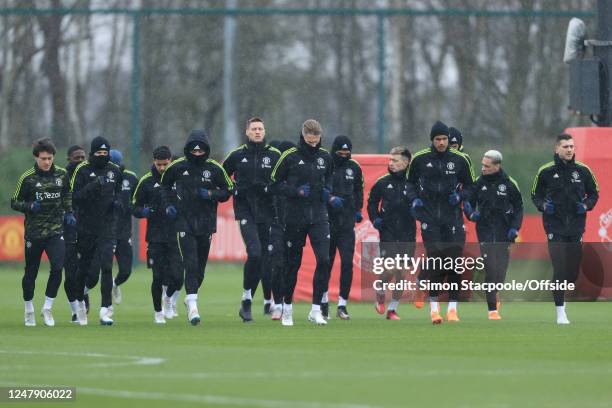 Players warm up before a training session ahead of their UEFA Europa League round of 16 leg one match against Real Betis at Old Trafford on March 8,...