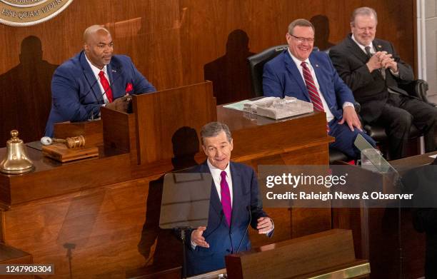 Gov. Roy Cooper delivers his State of the State address to a joint session of the N.C. General Assembly on Monday, March 6, 2023 as, from left, Lt....