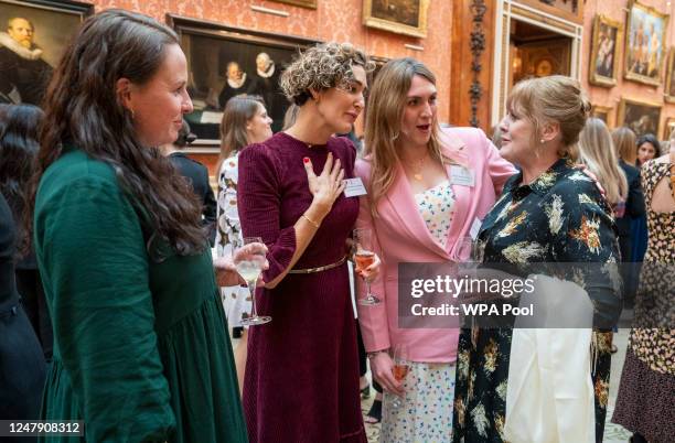 Sarah Lancashire with Atlantic rowers Kathryn Cordinge, Abby Waddilove and Charlotte Irving during a reception at Buckingham Palace for International...