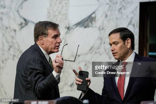 Committee chairman Sen. Mark Warner talks with ranking member Sen. Marco Rubio during a Senate Intelligence Committee hearing concerning worldwide...