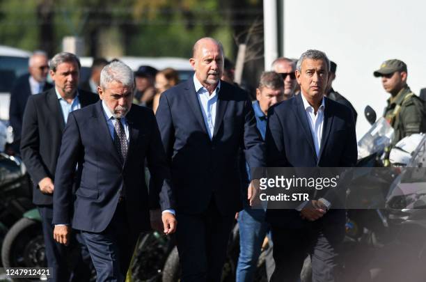 Argentina's Security Minister Anibal Fernandez, Santa Fe Governor Omar Perotti and Rosario's Mayor Pablo Javkin, arrive at the presentation of a...