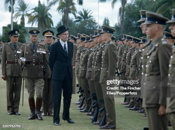 Rhodesian Defence Minister Pieter van der Byl inspecting troops at a Passing Out Parade in Salisbury, Rhodesia, circa 1975.