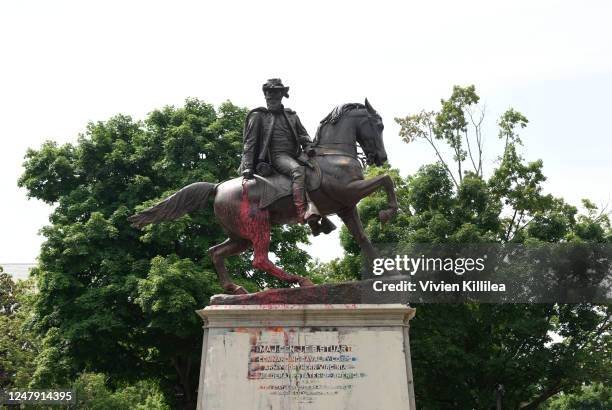 Splashes of paint are seen on the J. E. B. Stuart Monument amidst protests to remove the Confederate statues on Monument Avenue in Richmond,...