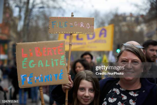 Thousands of women and men are taking to the streets of Toulouse on March 8th 2023 for International Women's Day, holding cardboard reading 'Liberty,...