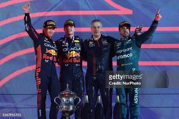 Sergio Perez, Max Verstappen of Red Bull Racing and Fernando Alonso of Aston Martin Aramco at the podium after the Formula 1 Bahrain Grand Prix at...
