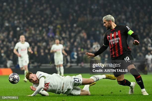 Tottenham Hotspur's Swedish midfielder Dejan Kulusevski reacts as he falls next to AC Milan's French defender Theo Hernandez during the UEFA...