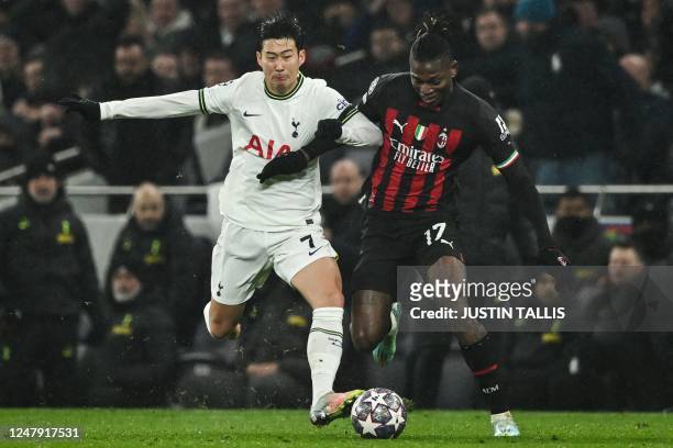 Tottenham Hotspur's South Korean striker Son Heung-Min fights for the ball with AC Milan's Portuguese forward Rafael Leao during the UEFA Champions...