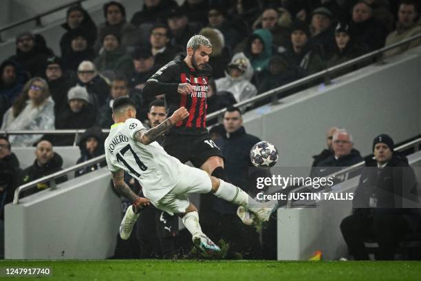 Tottenham Hotspur's Argentinian defender Cristian Romero tackles AC Milan's French defender Theo Hernandez during the UEFA Champions League round of...