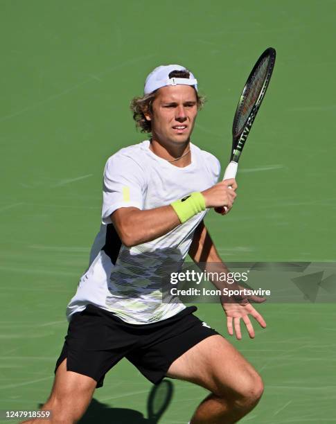 Aleksandar Kovacevic of the United States looks down court after hitting the ball during a tennis match at the BNP Paribas Open played on March 8,...