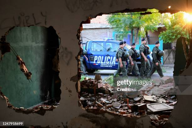 Members of Argentina's Gendarmerie patrol the neighborhood "Los Pumitas" in the north of Rosario, Santa Fe, Argentina on March 8, 2023. - The...