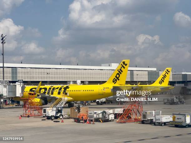 Spirit airlines planes sits at the gate at George Bush Intercontinental Airport in Houston, Texas, on March 8, 2023. - The US Justice Department on...