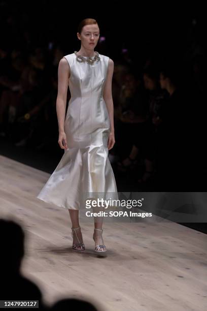 Model showcases designs by Rachel Gilbert during the Melbourne Fashion Festival on International Women's Day at the Royal Exhibition building in...