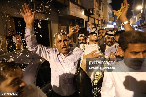 People celebrate wedding during the traditional ceremony at the street in Manama, Bahrain on March 2, 2023.