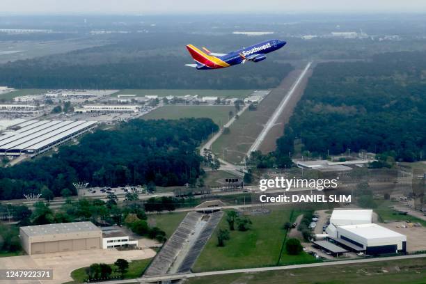 This photograph taken on March 8, 2023 shows a Soutwest airlines aircraft taking off from George Bush International Airport in Houston Texas.