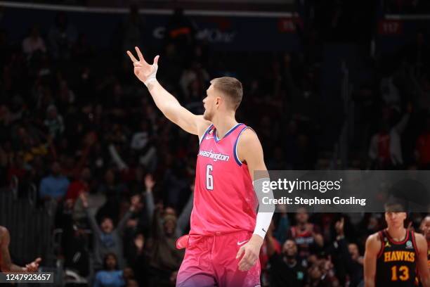 Kristaps Porzingis of the Washington Wizards celebrates a three point basket during the game against the Atlanta Hawks on March 8, 2023 at Capital...