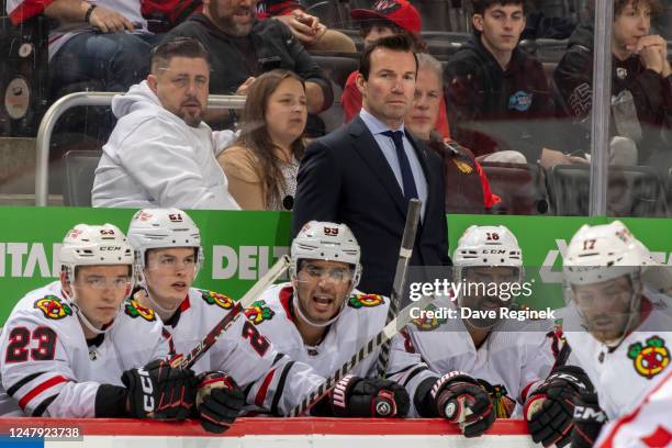 Head coach Luke Richardson of the Chicago Blackhawks watches the action from the bench against the Detroit Red Wings during the second period of an...