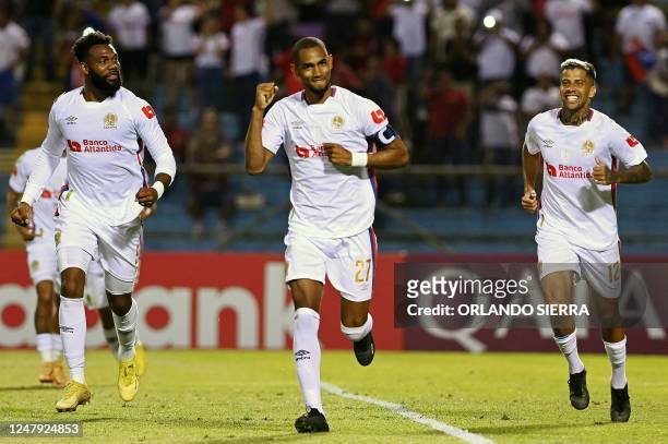 Olimpia's Jerry Bengtson celebrates with teammates after scoring against Atlas during the CONCACAF Champions League first leg football match between...