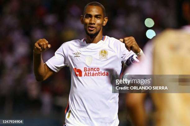 Olimpia's Jerry Bengtson celebrates after scoring against Atlas during the CONCACAF Champions League first leg football match between Honduras'...