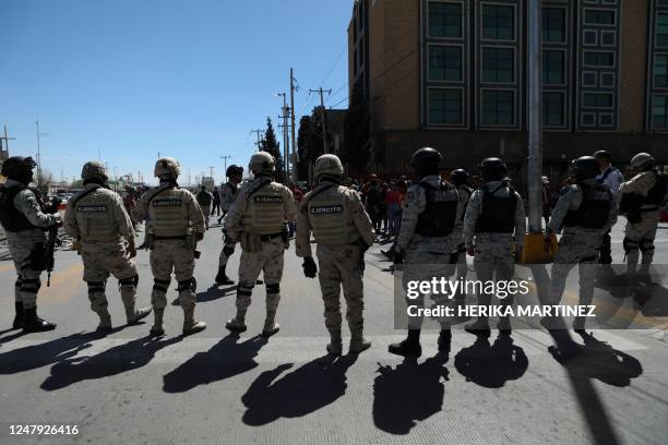 National Guard agents take part in an operation by the Mexican National Migration Institute to detain migrants in Ciudad Juarez, Chihuahua State,...