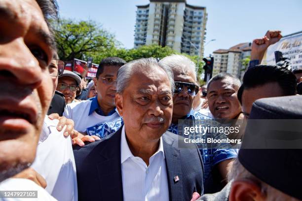 Muhyiddin Yassin, Malaysia's former prime minister, center, arrives at the Malaysian Anti-Corruption Commission headquarters in Putrajaya, Malaysia,...