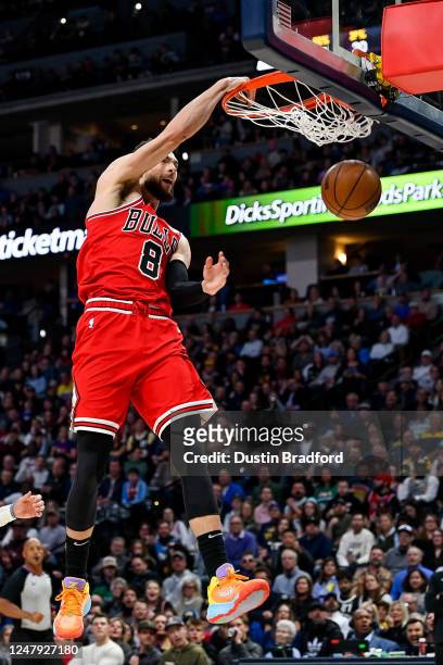 Zach LaVine of the Chicago Bulls jumps and slams the ball for two points in the second half of a game against the Denver Nuggets at Ball Arena on...