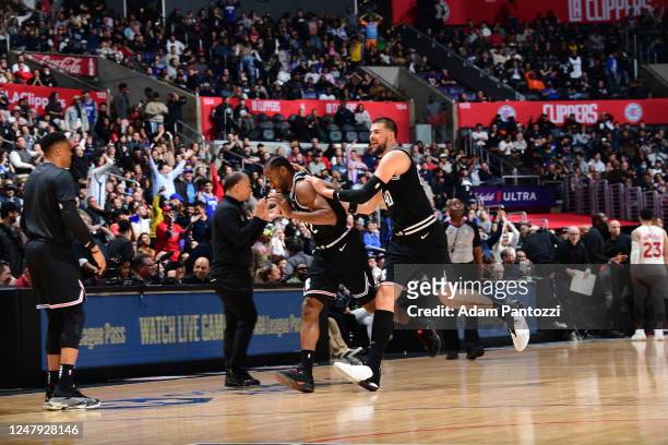 Clippers celebrate a play by Kawhi Leonard during the game against the Toronto Raptors on March 8, 2023 at Crypto.Com Arena in Los Angeles,...