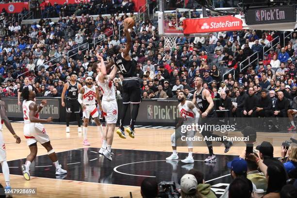Terance Mann of the LA Clippers dunks the ball during the game against the Toronto Raptors on March 8, 2023 at Crypto.Com Arena in Los Angeles,...