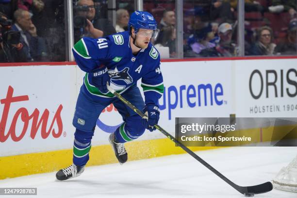 Vancouver Canucks center Elias Pettersson skates with the puck during their NHL game against the Anaheim Ducks at Rogers Arena on March 8, 2023 in...