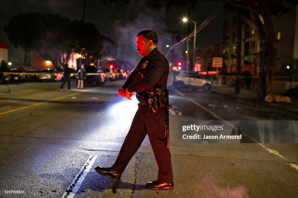 Lapd Riot Officers A LAPD officer puts out flares as he secures the scene where 3 LAPD ...