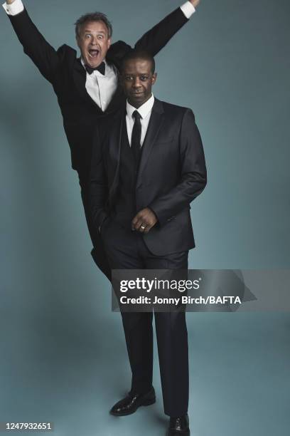 Actors Hugh Bonneville and Adrian Lester are photographed for BAFTA at the House of Fraser British Academy Television Awards on May 16, 2016 in...