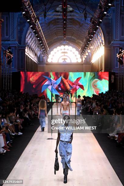 Models parade outfits by Australian label Ginny's Girl Gang during the 2023 Melbourne Fashion Festival in Melbourne on March 9, 2023.