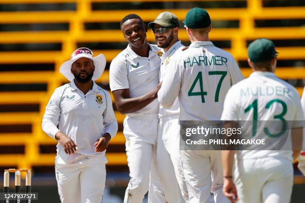 South Africa's Kagiso Rabada celebrates with teammates after the dismissal of West Indies' Kyle Mayers during the second day of the second Test...